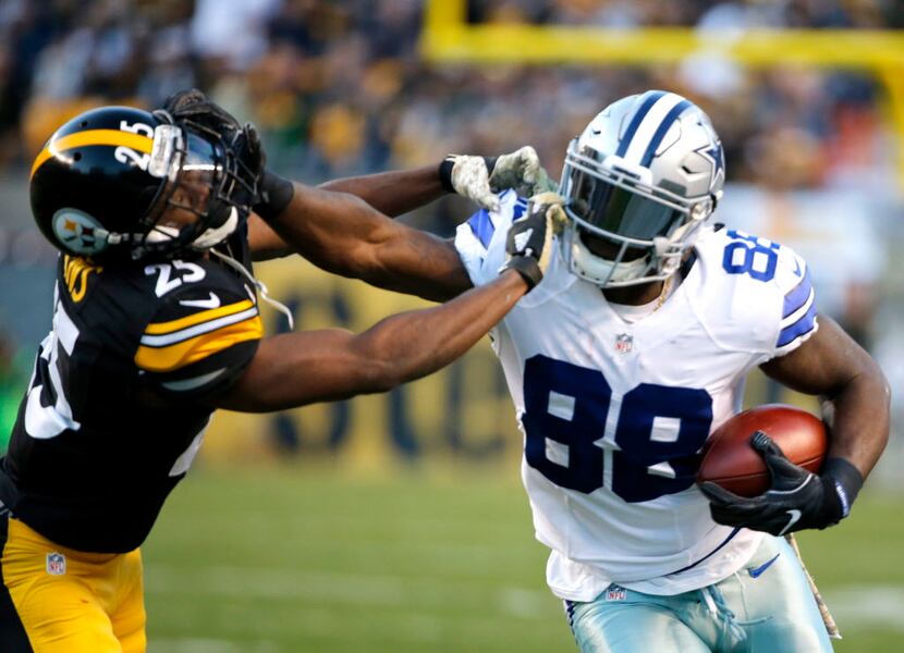 Dallas Cowboys wide receiver Dez Bryant (88) grabs the face mask of Pittsburgh Steelers...