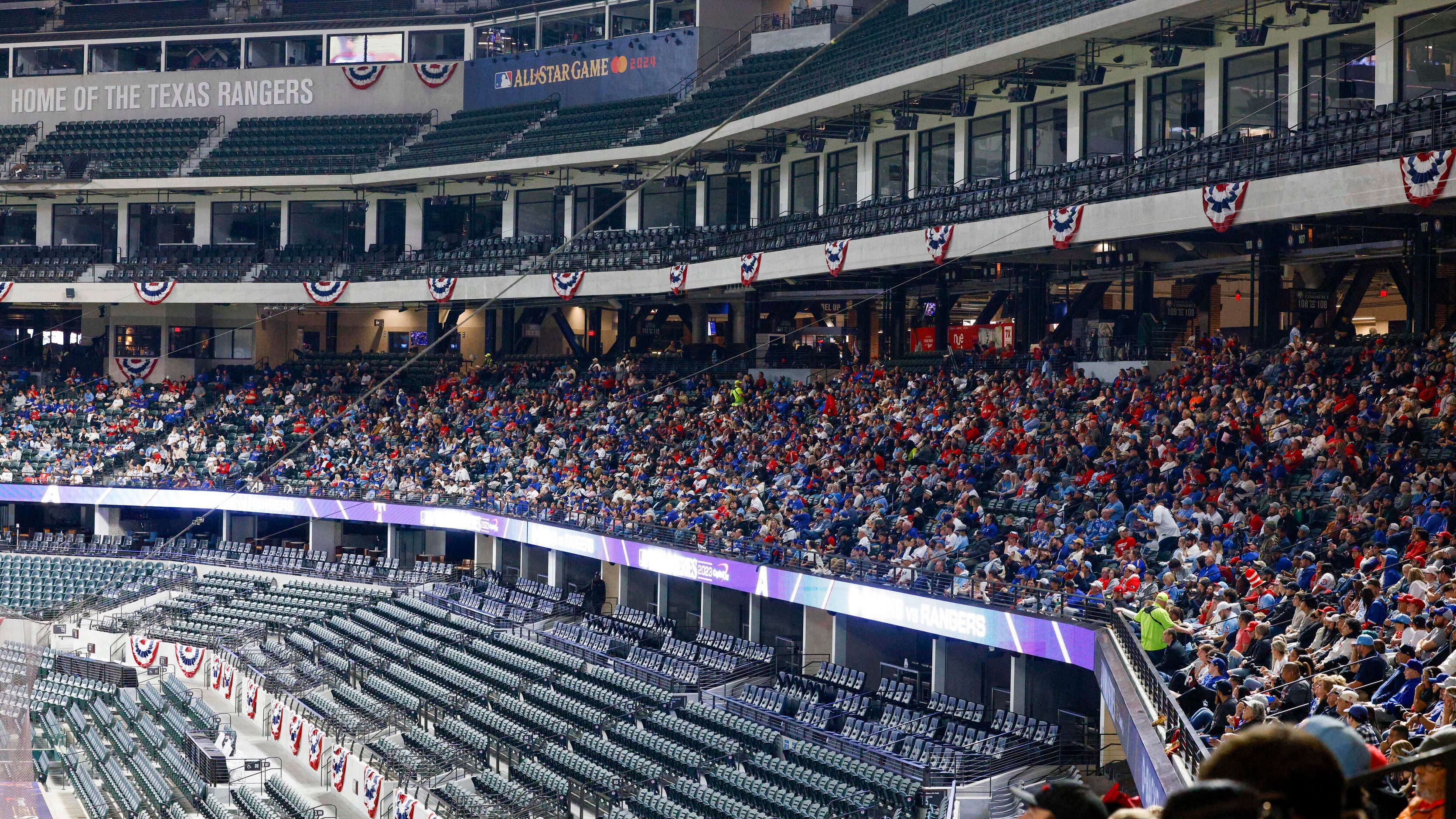 Texas Rangers fans fill the main concourse during the third inning in Game 3 of the World...