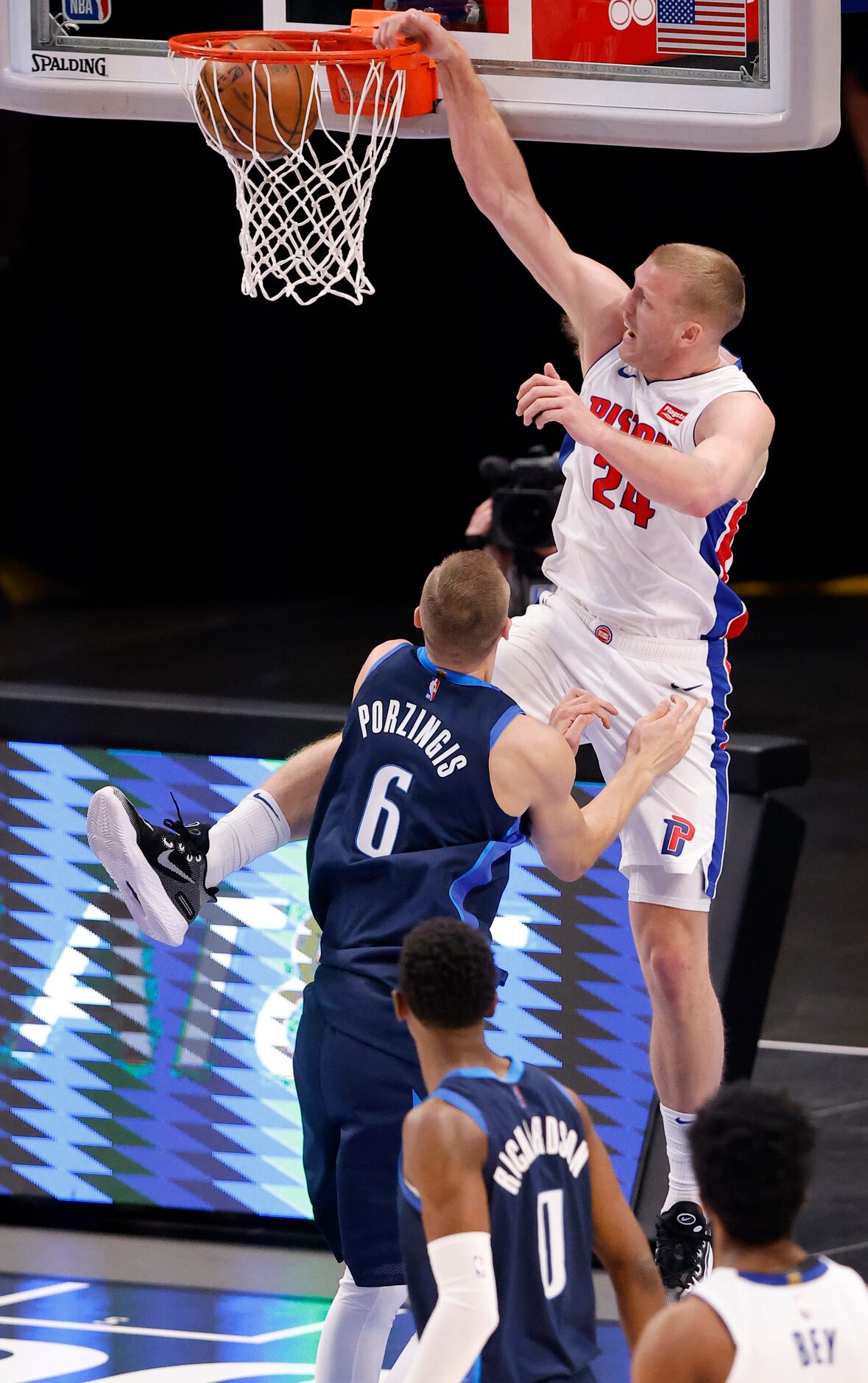 Detroit Pistons center Mason Plumlee (24) dunks the ball over Dallas Mavericks center...