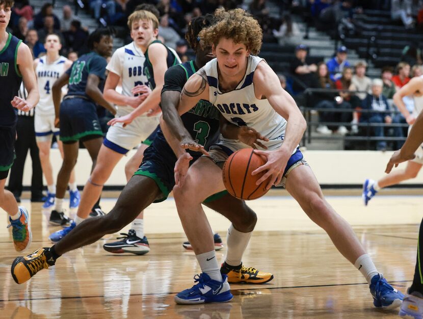 Byron Nelson’s Finley Bizjack (3) keeps the ball from V.R. Eaton’s Lamont Stokes (3) at...