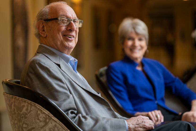 Edgemere Senior Living resident Dr. Paul Radman (left) and his partner, Jane, sit in arm...
