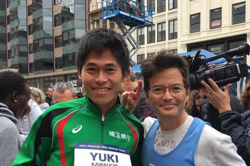 Yuki Kawauchi of Japan, the men's winner of the 2018 Boston Marathon, posed with David Ball...