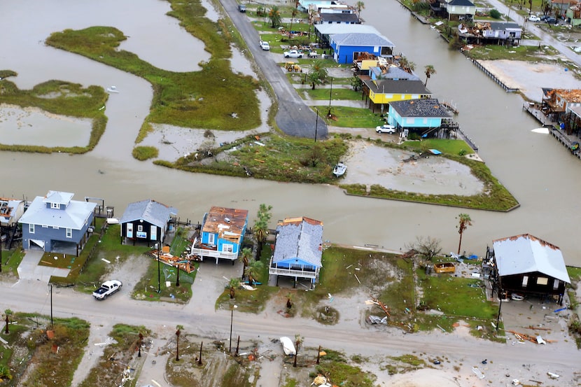 This aerial photo shows damaged homes in the wake of Hurricane Harvey, Monday, Aug. 28,...