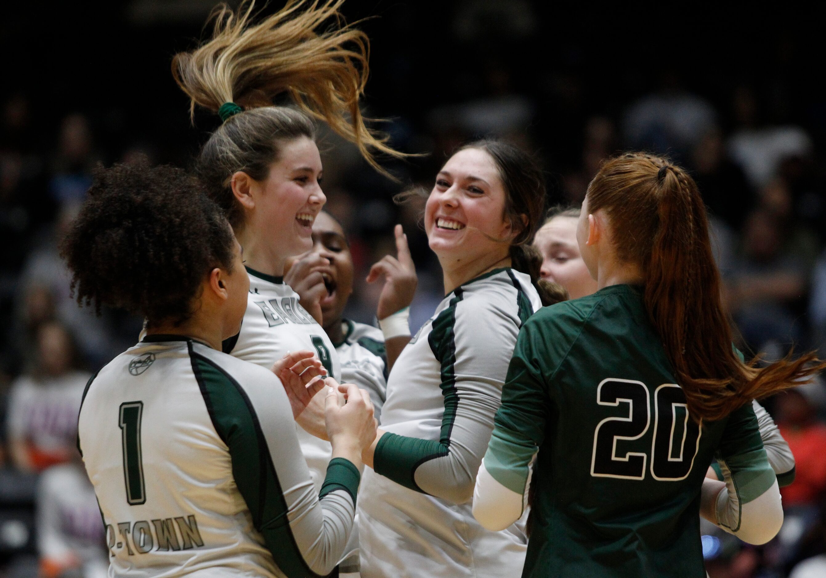 Prosper's Ayden Ames (9), center left, reacts with teammates including Allie Duitsman (12),...