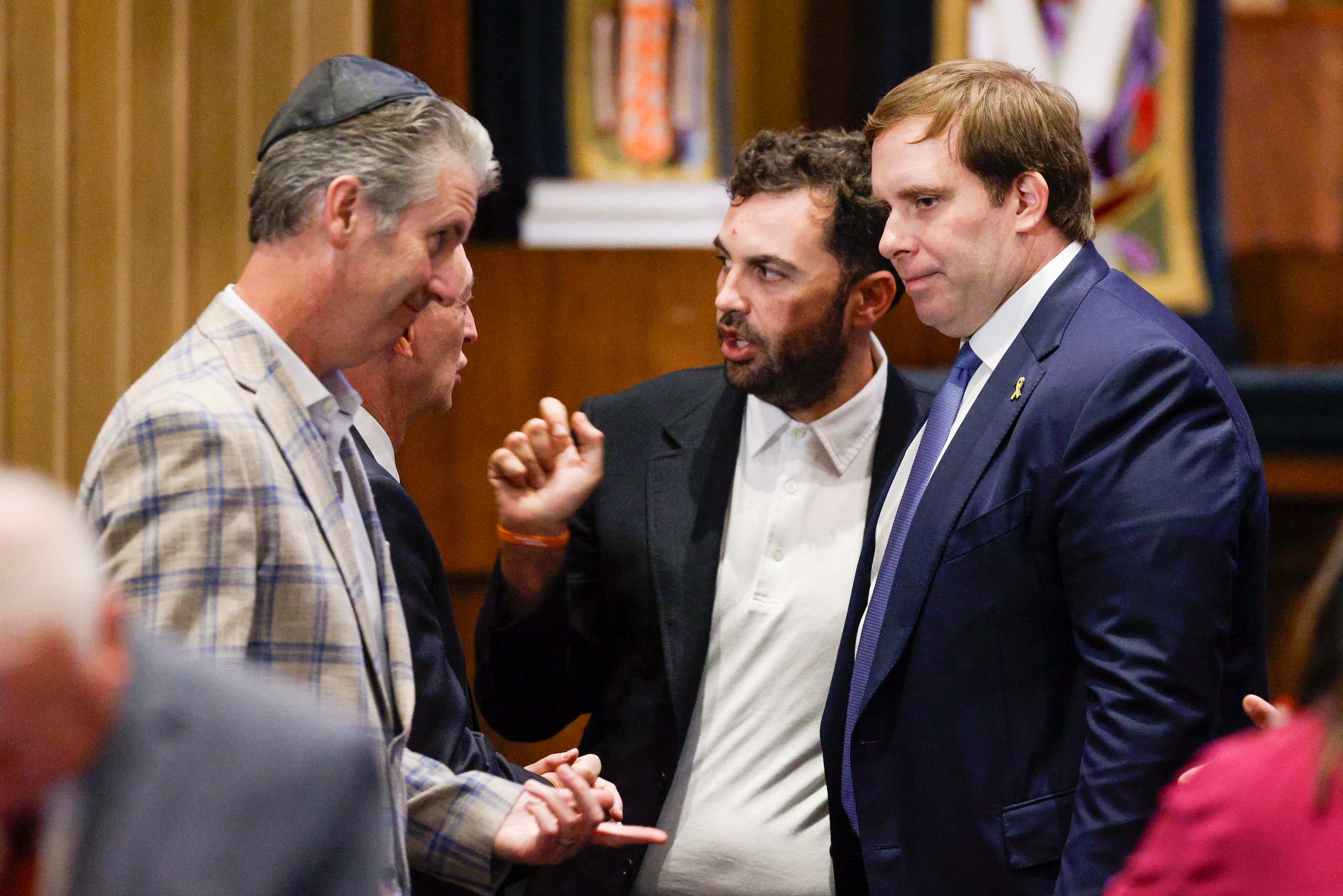 Dallas Mavericks governor Patrick Dumont (right) speaks with people before a community event...