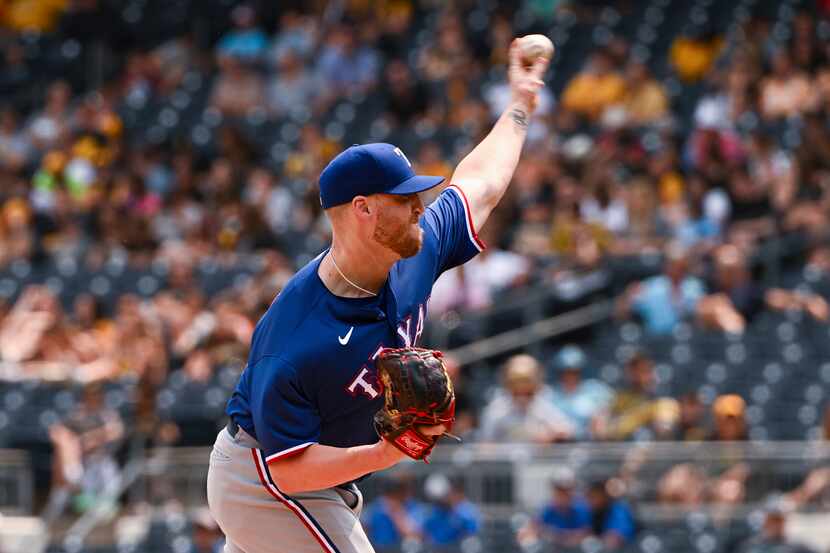 Texas Rangers relief pitcher Will Smith (51) delivers against the Pittsburgh Pirates in the...