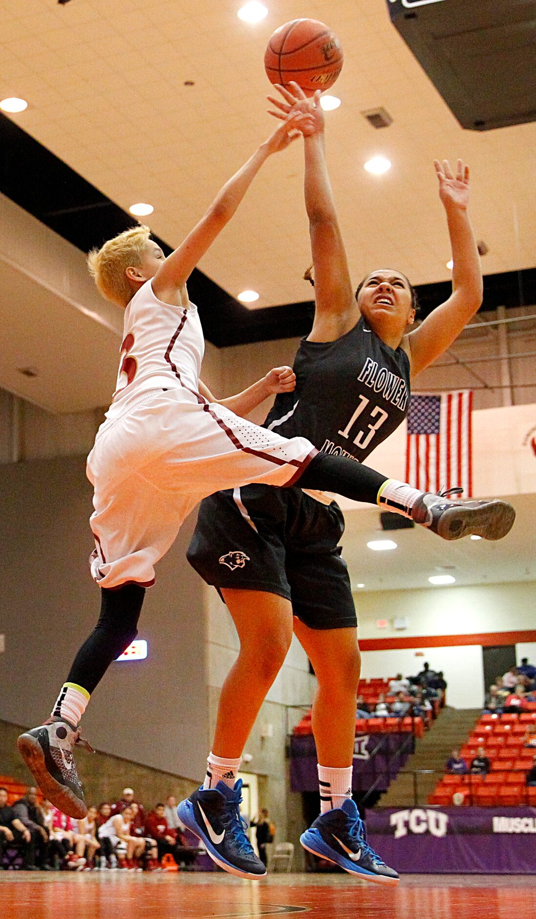 Flower Mound forward Marin Mills (13) is fouled by El Paso El Dorado point guard Rebecca...