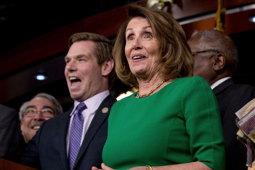 House Minority Leader Nancy Pelosi of California, accompanied by Reps. G. K. Butterfield,...