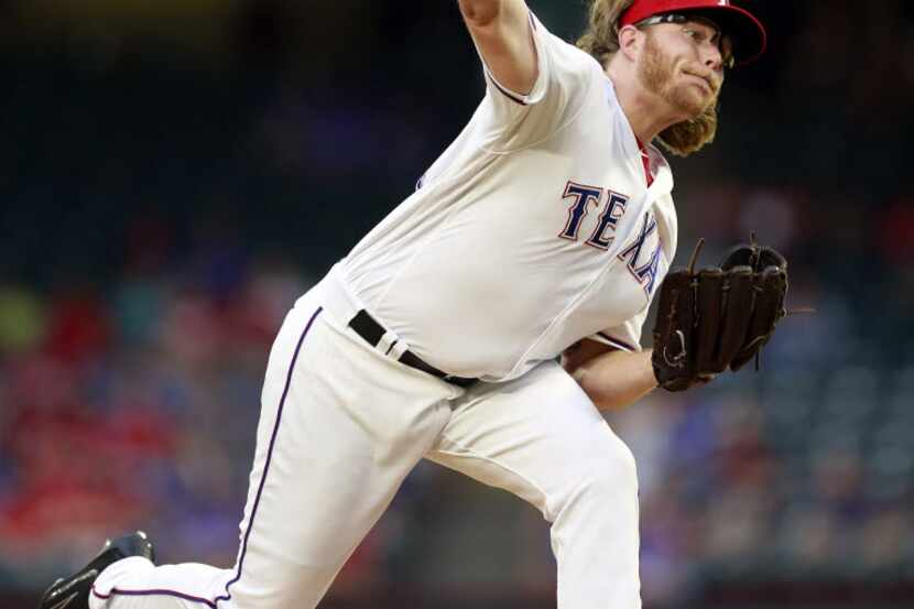 Texas Rangers starting pitcher A.J. Griffin throws in the first inning against the New York...