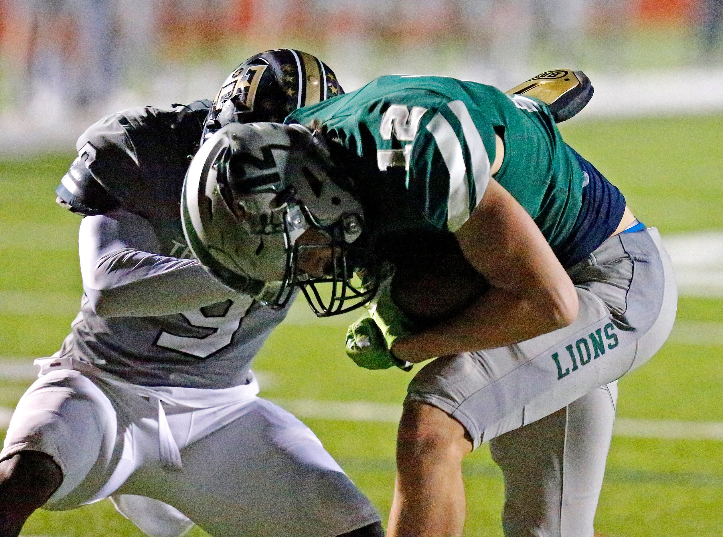 Frisco Reedy High School wide receiver Erik Barr (12) makes it across the goal line in front...