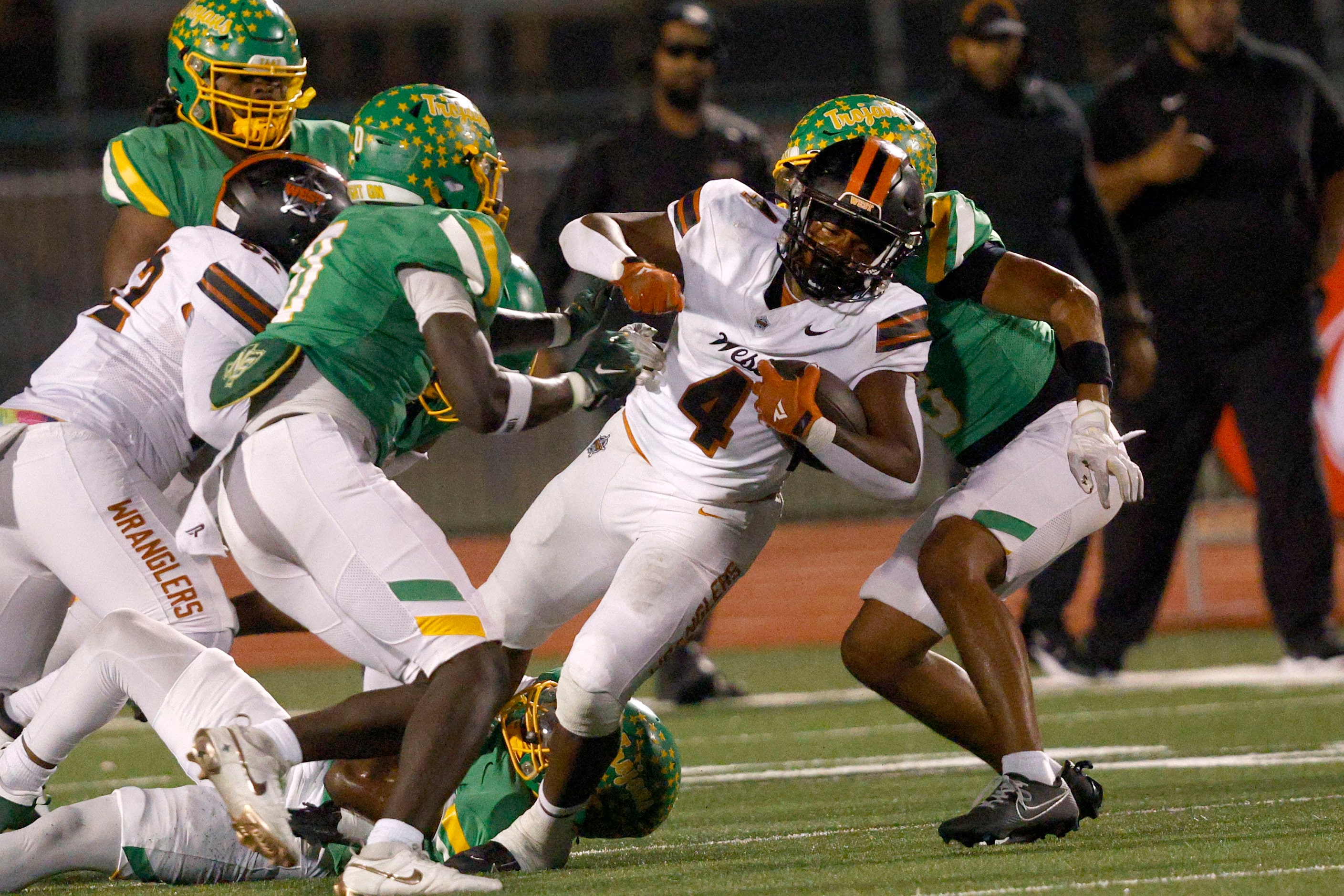 West Mesquite's Damarian Robinson (4) keeps the ball away from Newman Smith players in the...