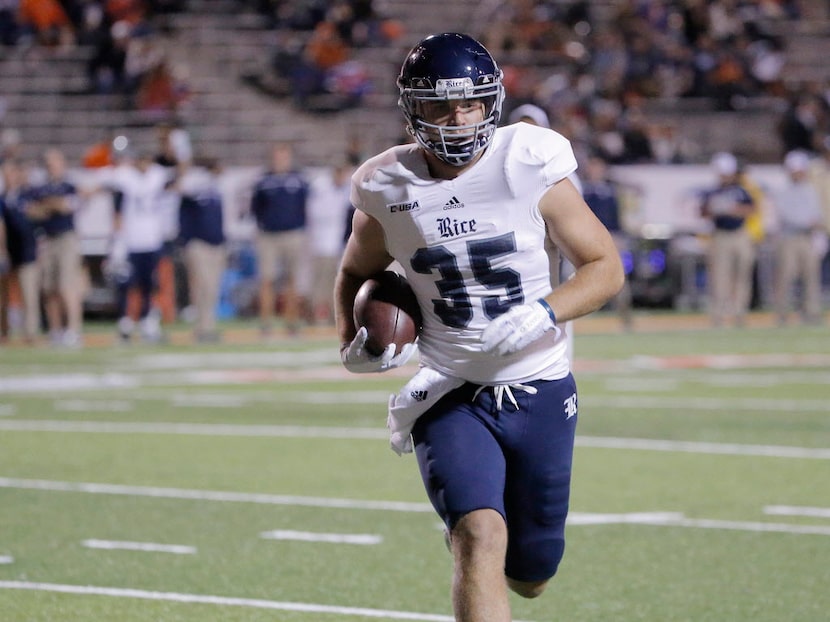 Rice running back Luke Turner takes the ball into the end zone untouched during the first...