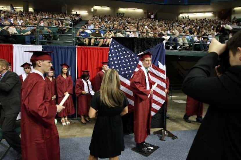  Some students wear white honor stoles at Plano Senior High's graduation in 2008. (File...