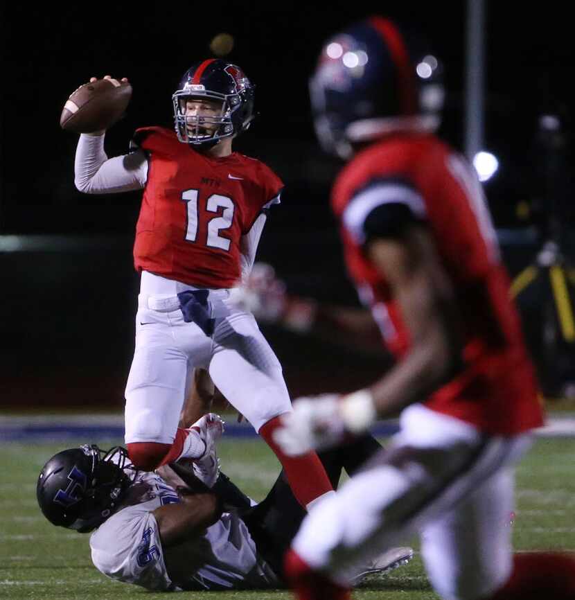 McKinney Boyd quarterback Grant Restmeyer (12) is sacked on a second down and 9yards to go...