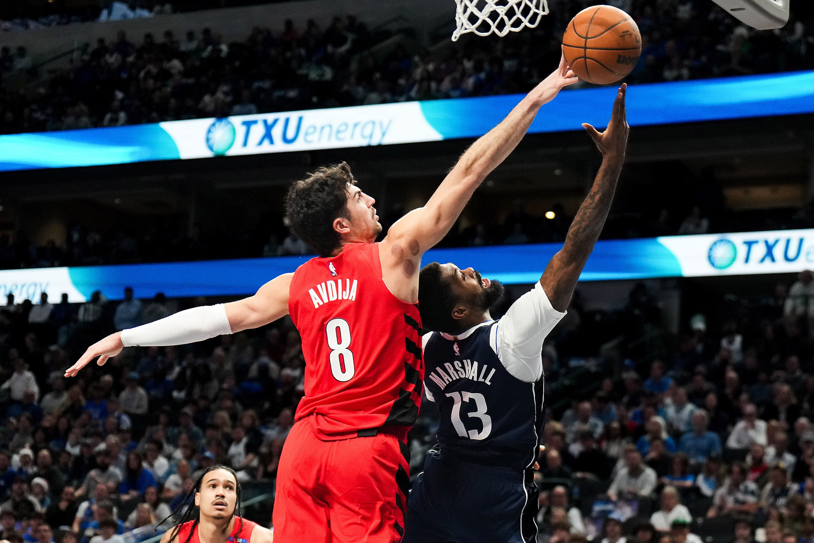 Portland Trail Blazers forward Deni Avdija (8) blocks a shot by Dallas Mavericks forward...