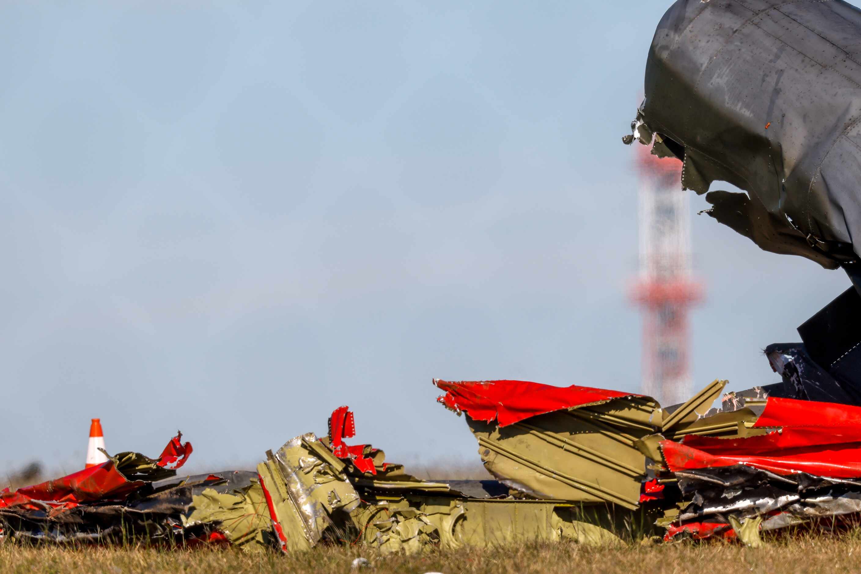 Debris lays scattered around a damaged plane at the Dallas Executive Airport on Sunday, Nov....