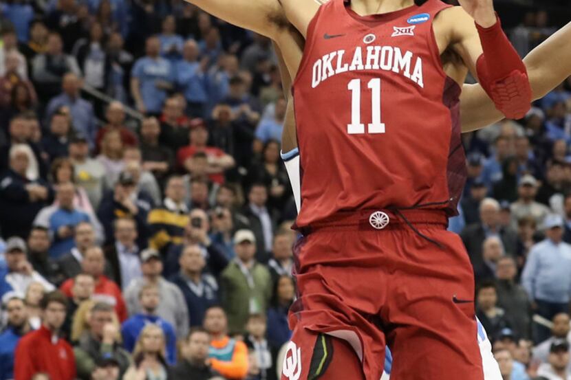 PITTSBURGH, PA - MARCH 15:  Trae Young #11 of the Oklahoma Sooners lays up against the Rhode...