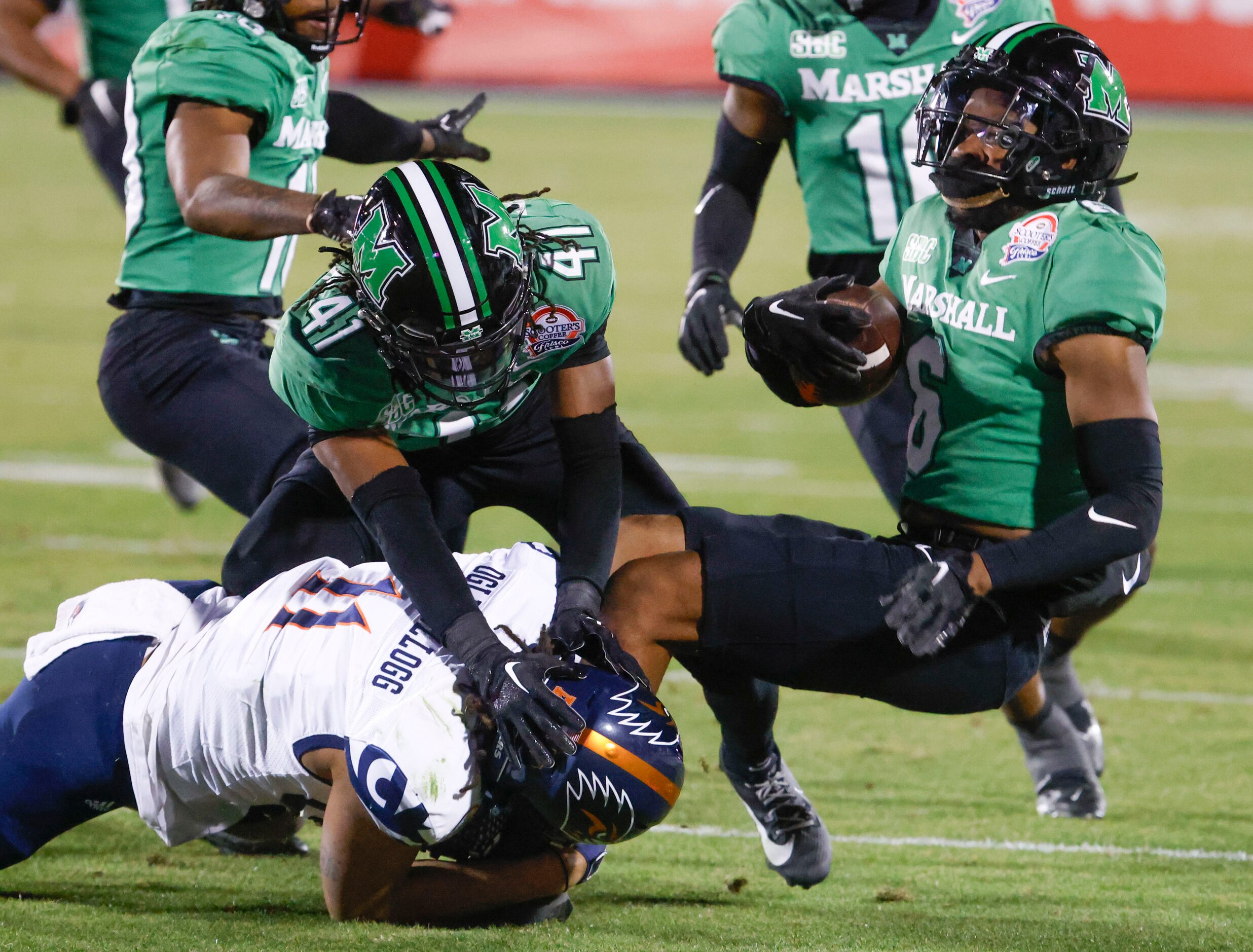 Marshall defensive back Micah Abraham (right) intercepts a pass intended for UTSA wide...