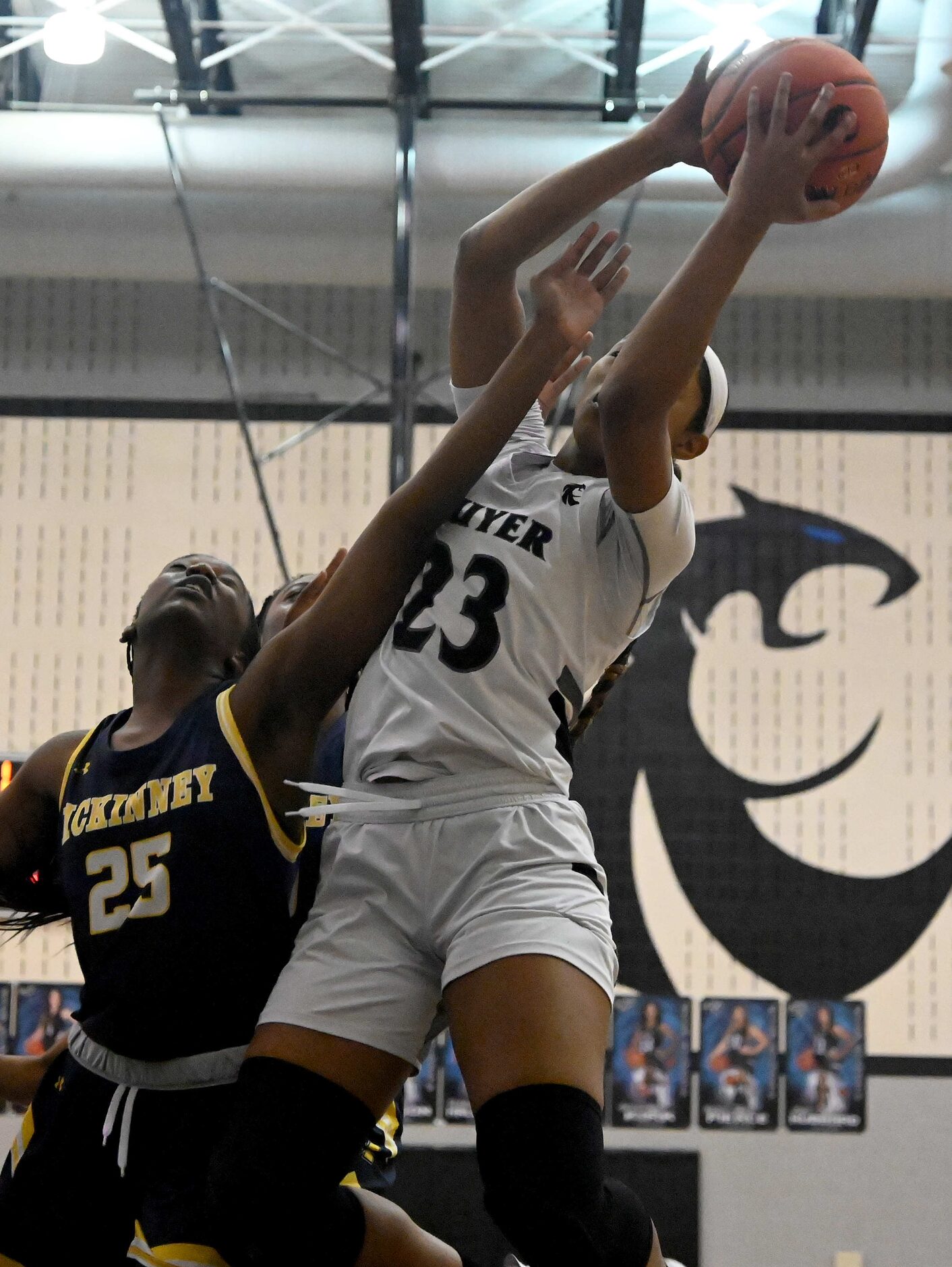 Denton Guyer’s Eryka Patton (23) grabs a rebound over McKinney’s Skylar Anamekwe in the...