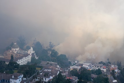 Smoke rises from fires in a forested area in the Guápulo neighborhood of Quito Ecuador,...