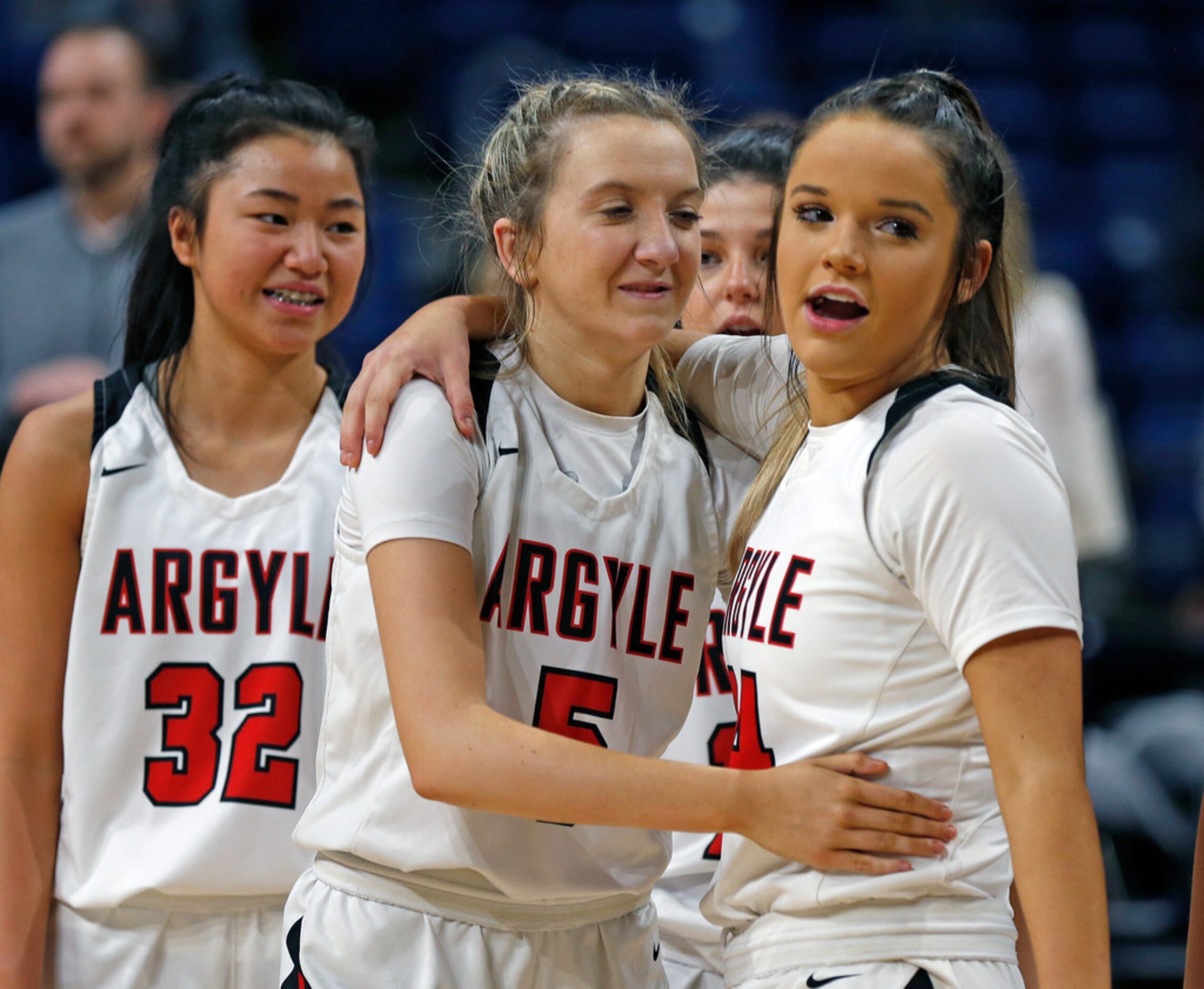 Argyle guard Rhyle McKinney #5 congratulates Argyle guard Abby Williams #24 at the end of...