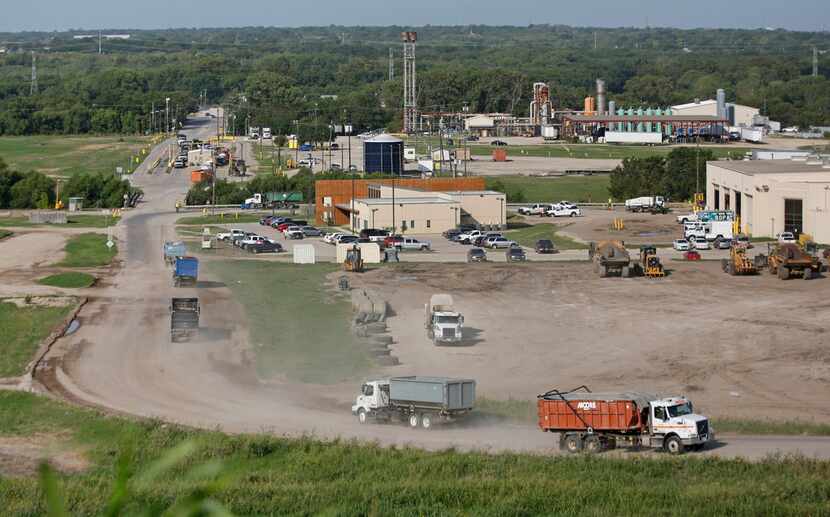 Trash trucks come and go at  steady pace at the McCommas Bluff Landfill at 5100 Youngblood...