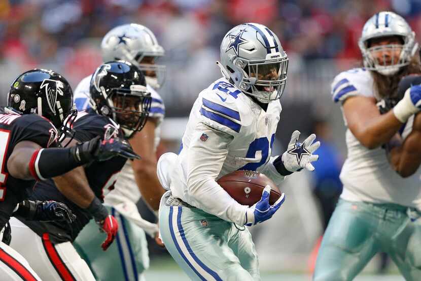 Dallas Cowboys running back Ezekiel Elliott (21) runs up the field on a 23 yard touchdown...