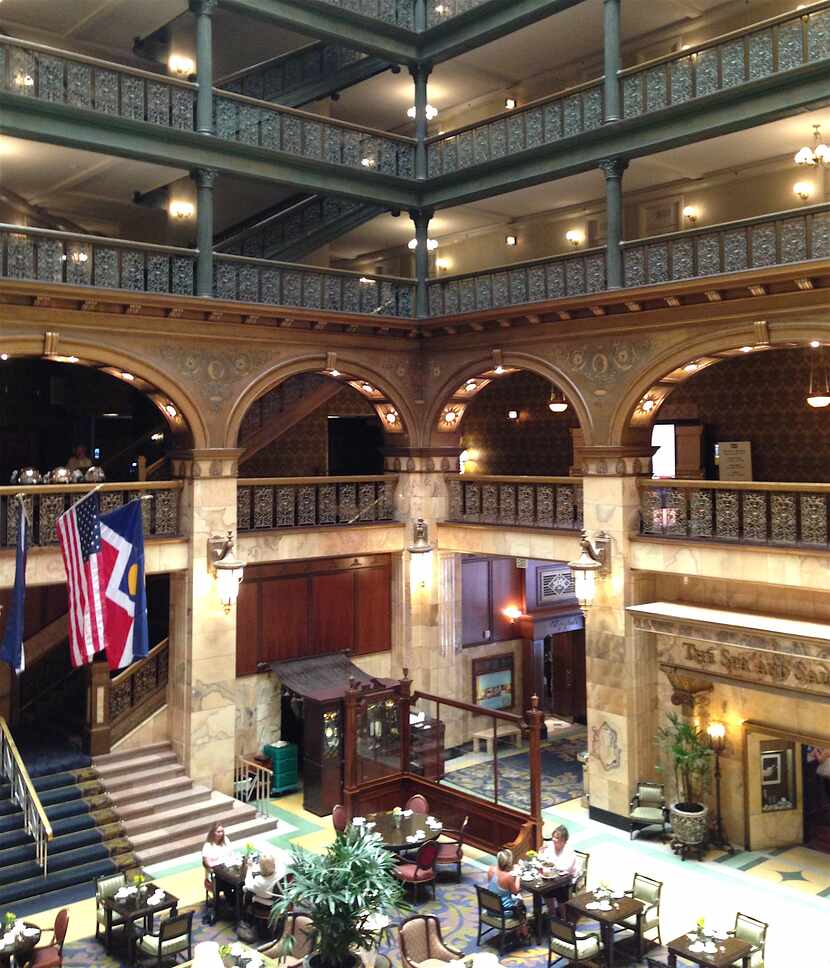 The landmark Brown Palace is known for its ornate atrium with stained-glass ceiling.