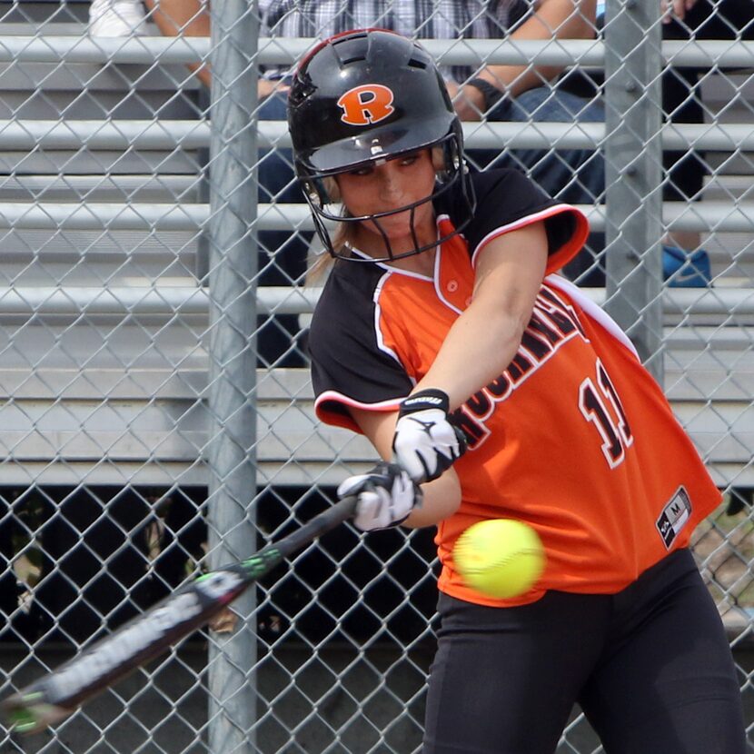 Rockwall's Jocelyn Myers (11) drives a pitch into the outfield during the first inning of...