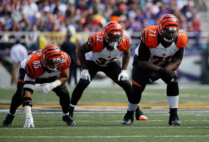 BALTIMORE, MD - SEPTEMBER 27:  Tyler Eifert #85,  Jeremy Hill #32 and  Andre Smith #71 of...