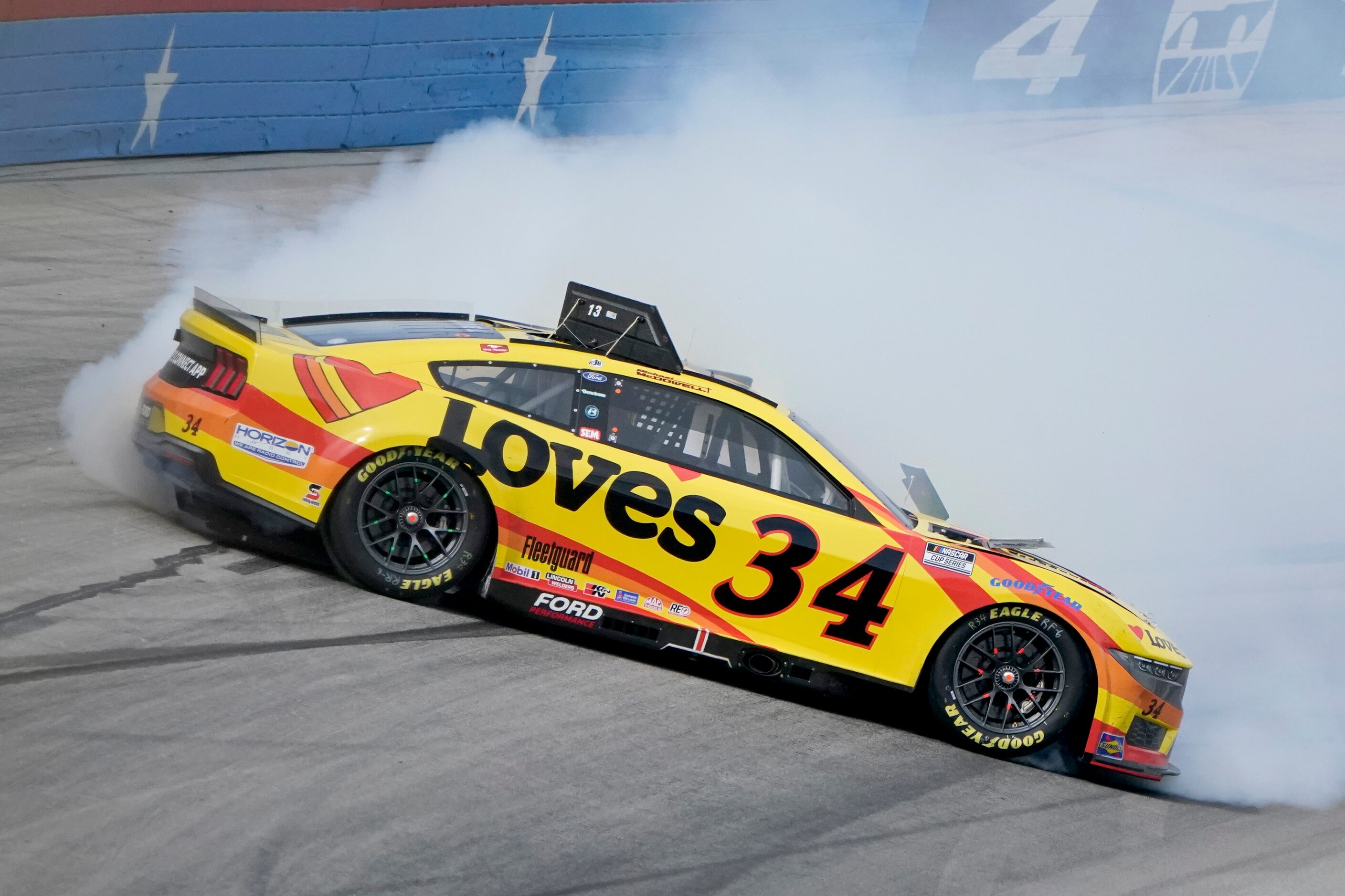 Michael McDowell (34) crashes in Turn 4 during a NASCAR Cup Series auto race at Texas Motor...