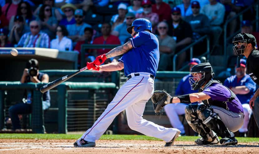Texas Rangers first baseman Mike Napoli (5) hits a home run during the second inning of a...
