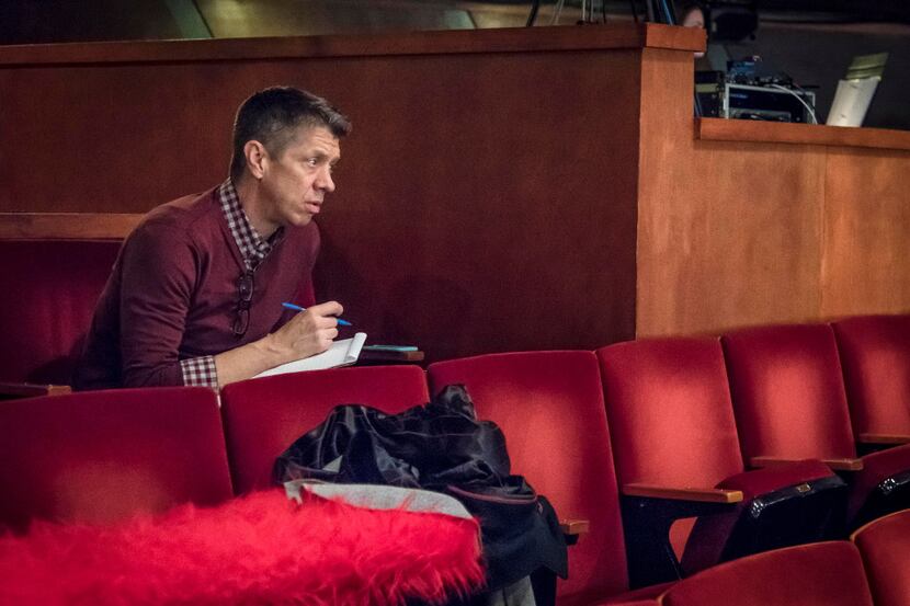 Director Joel Ferrell takes notes during the dress rehearsal of The Christians at the Kalita...