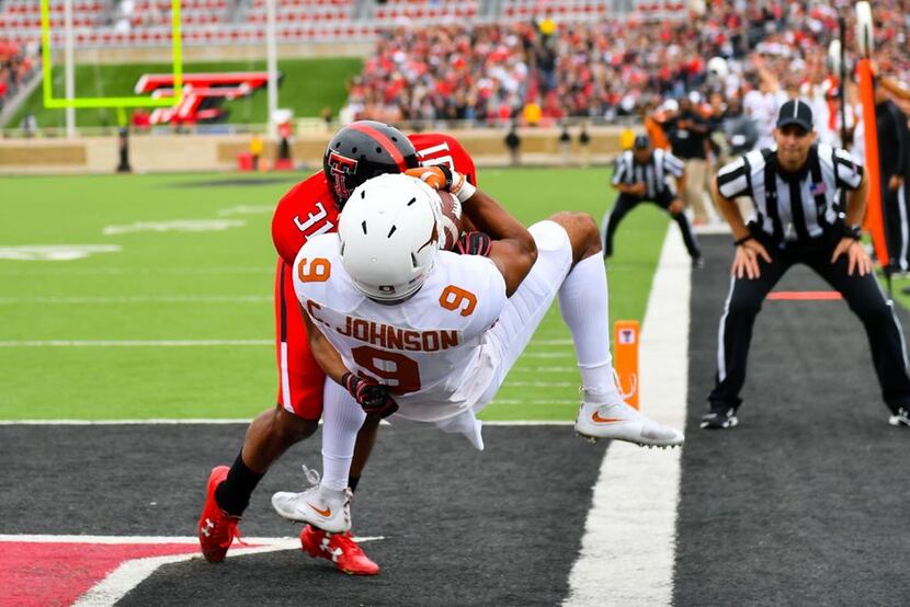 LUBBOCK, TX - NOVEMBER 05: Collin Johnson #9 of the Texas Longhorns catches a touchdown pass...