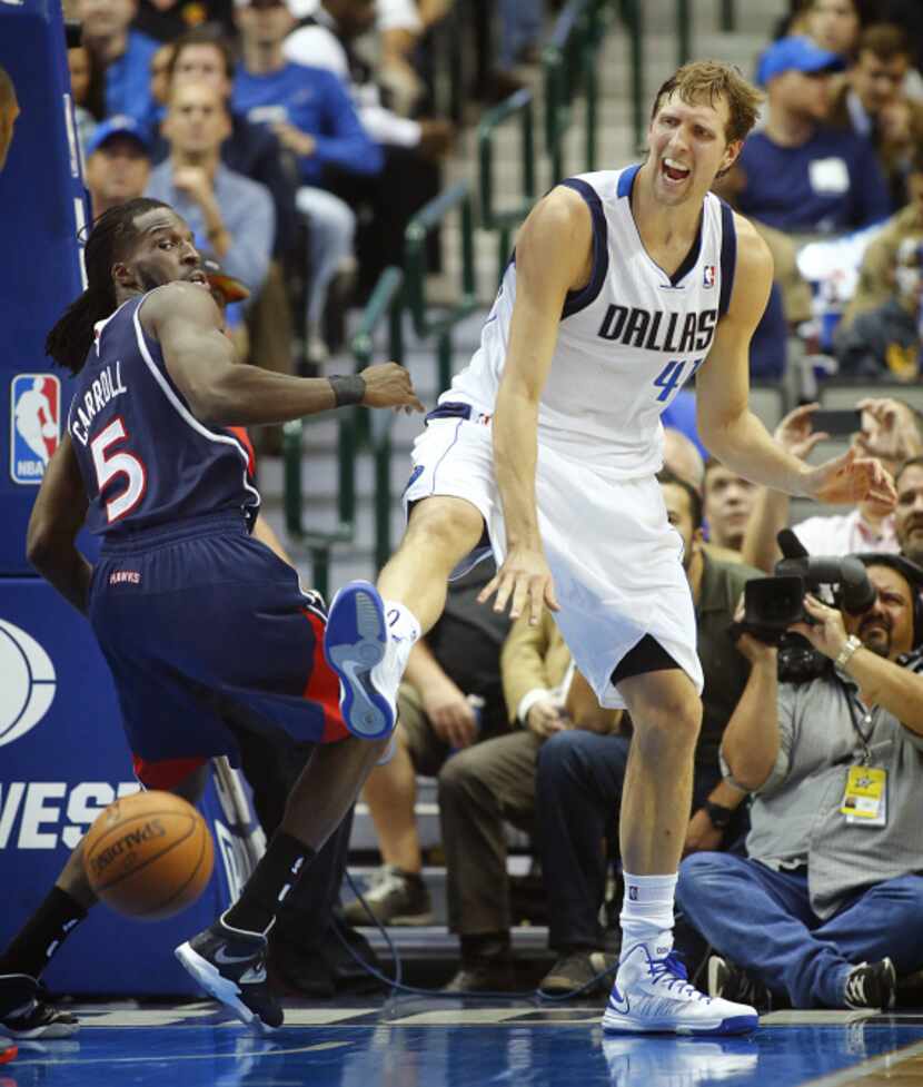 Miami Heat center Chris Bosh (1) puts up a shot over Dallas Mavericks center Bernard James...