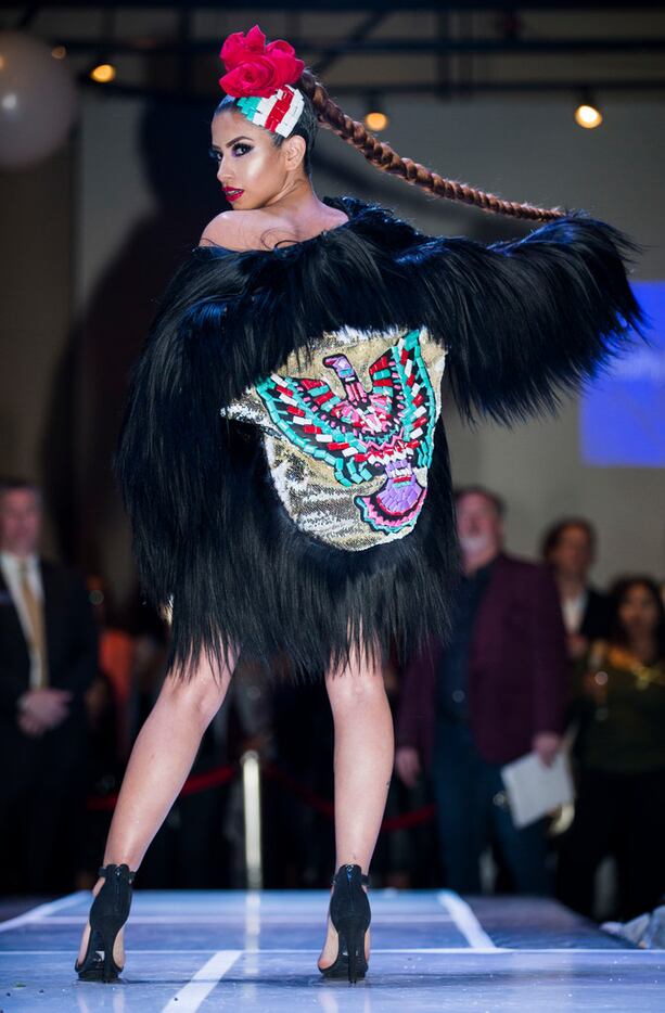 Model Carmen Benitez shows off a jacket with a candy rising Pheonix design during the...