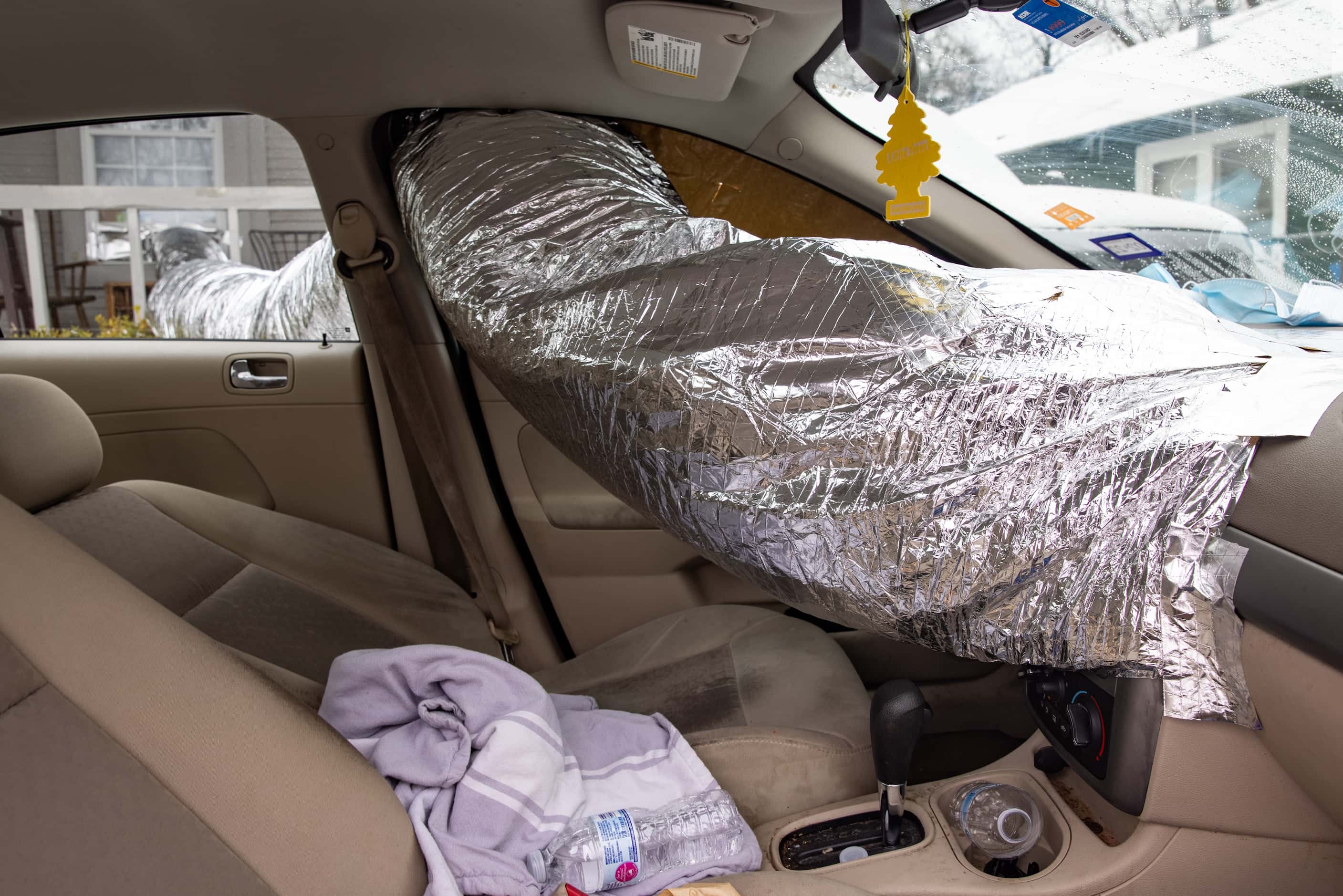 Leonel Solis and Estefani Garcia use their car to heat their home in East Dallas on...