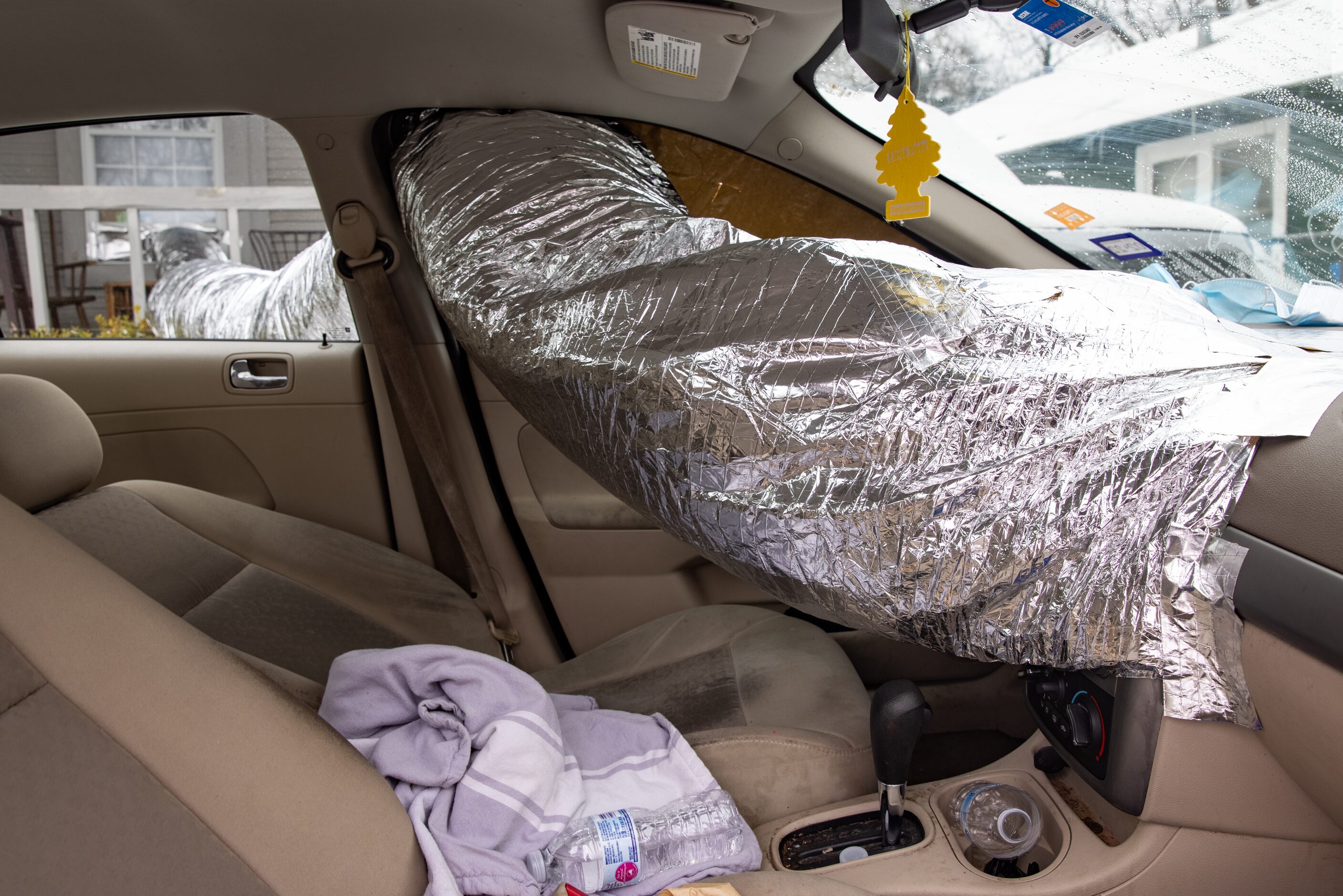 Leonel Solis and Estefani Garcia use their car to heat their home in East Dallas on...