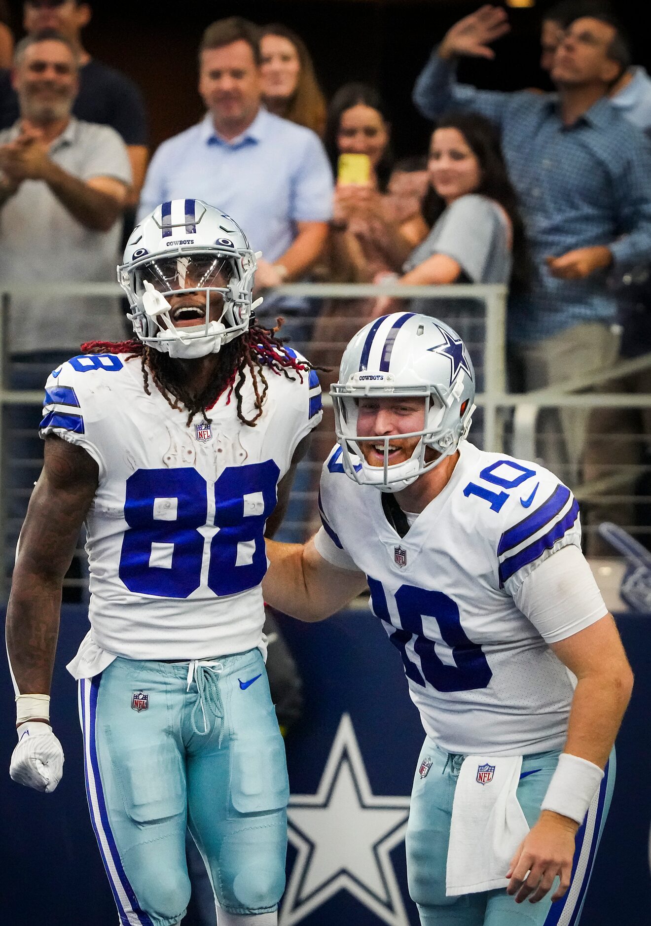 Dallas Cowboys quarterback Cooper Rush (10) celebrates with wide receiver CeeDee Lamb after...