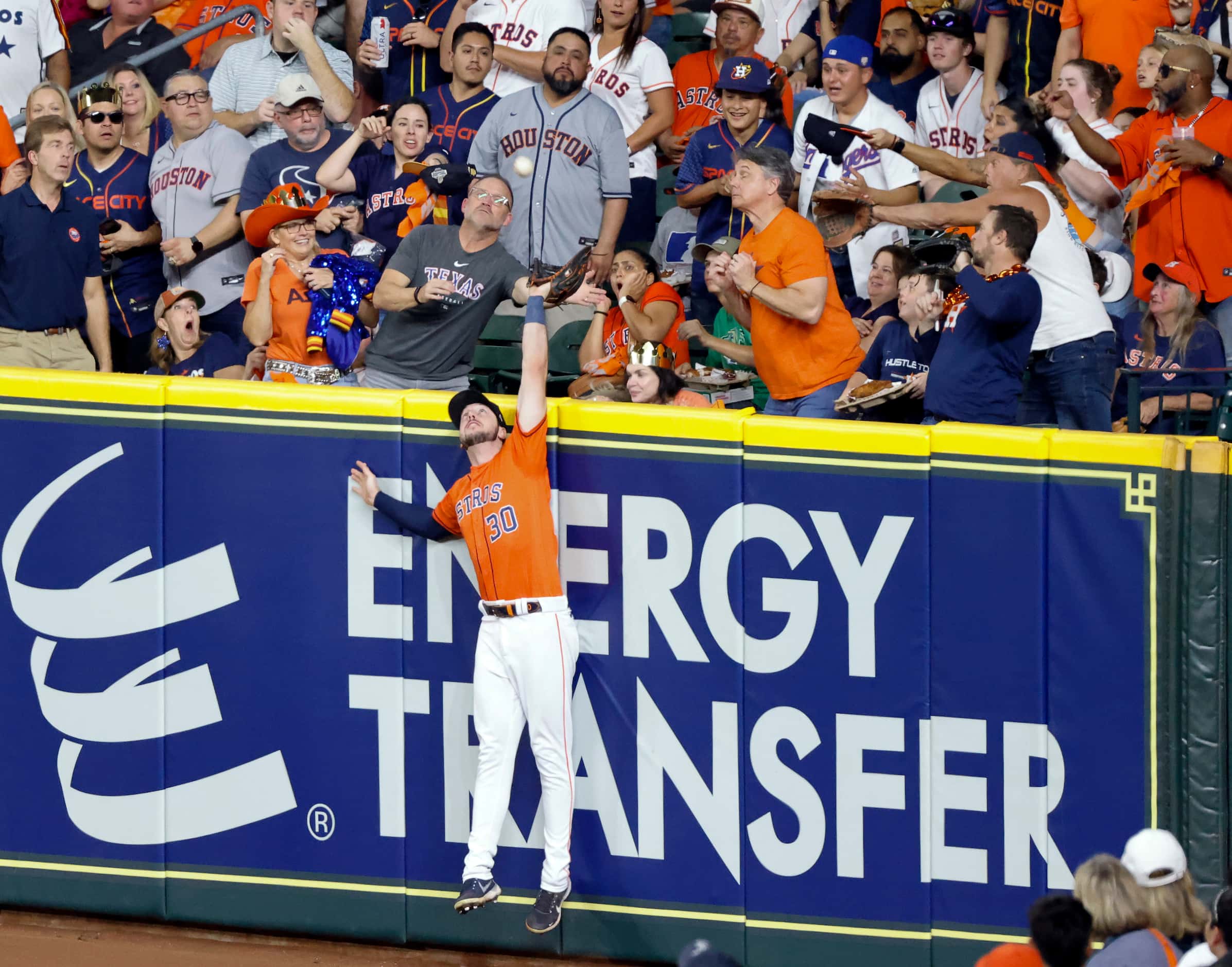 Houston Astros right fielder Kyle Tucker (30) goes up for a home run ball hit by Texas...