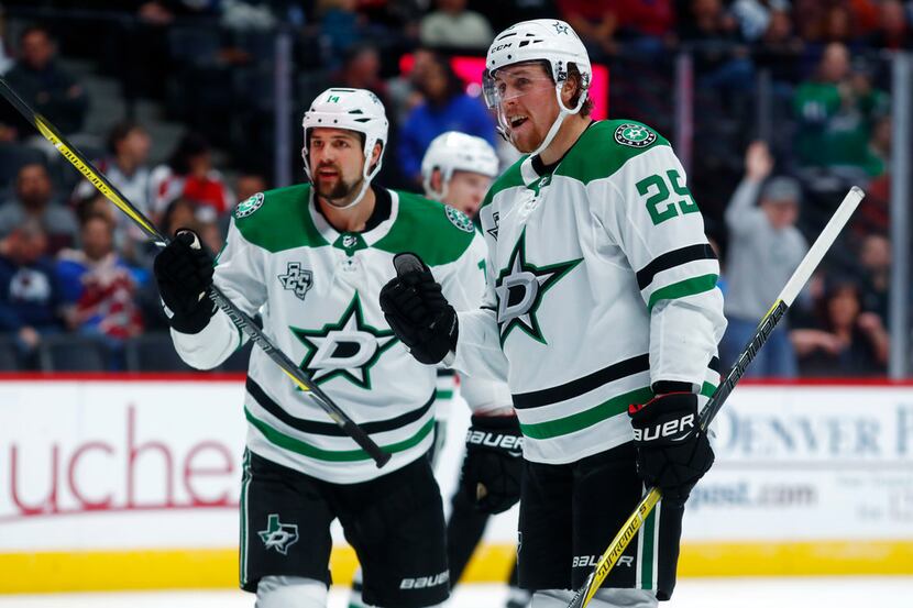 Dallas Stars right wing Brett Ritchie, right, celebrates his goal with left wing Jamie Benn...