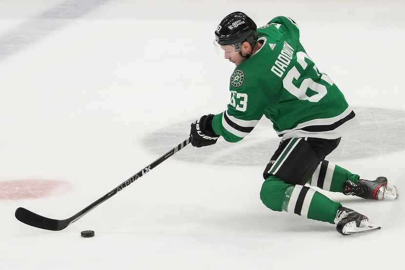 Dallas Stars right wing Evgenii Dadonov controls the puck during the second period of an NHL...