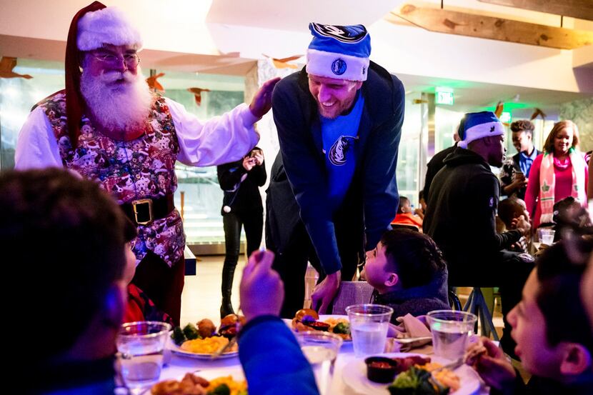 Dirk Nowitzki, here having fun with kids at a Christmas party earlier this month, spent...