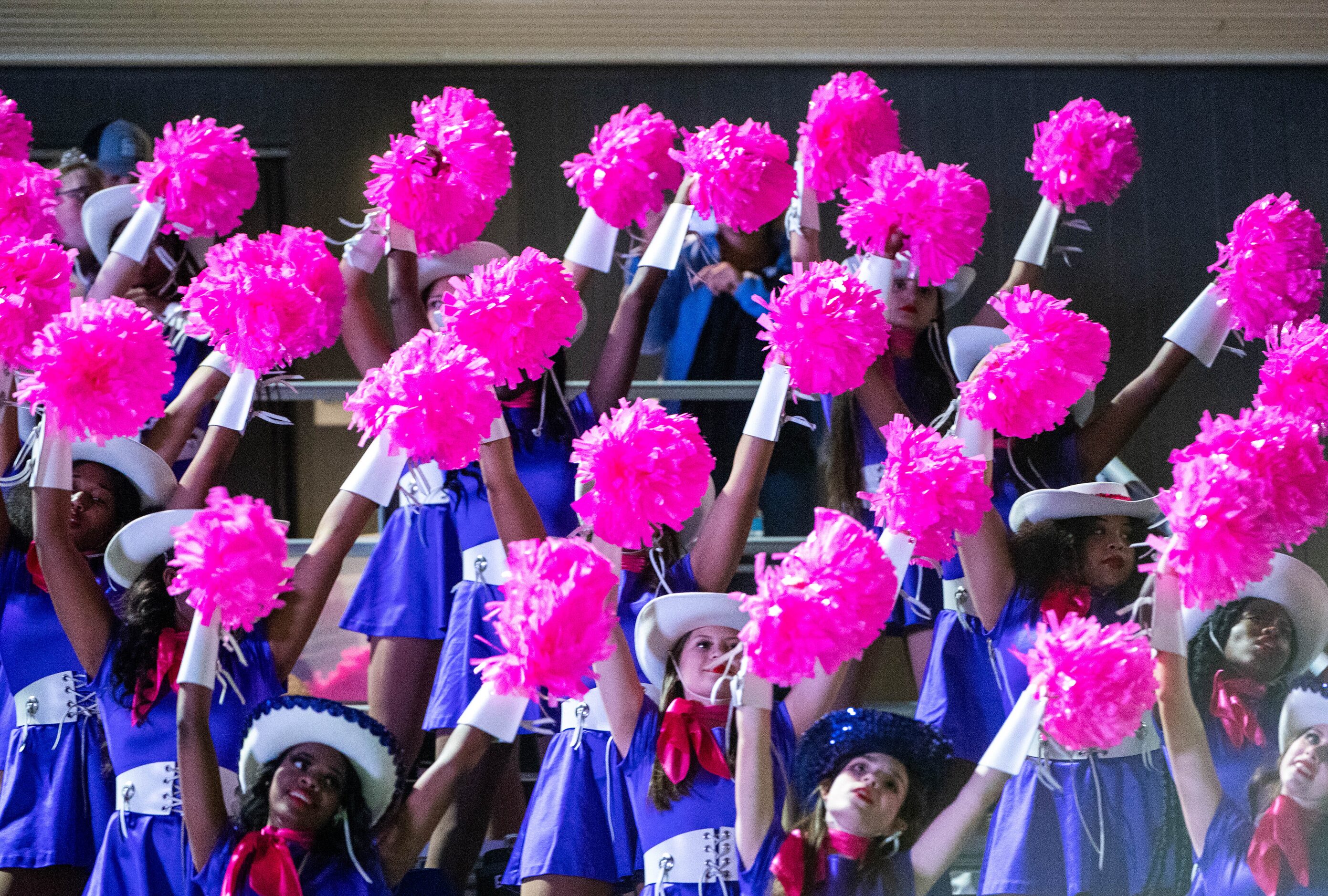 The Anna Coyettes perform in the stands in the first half during a high school football game...