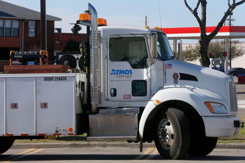 An Atmos Energy utility truck is parked near the construction site on Webb Chapel Road in...