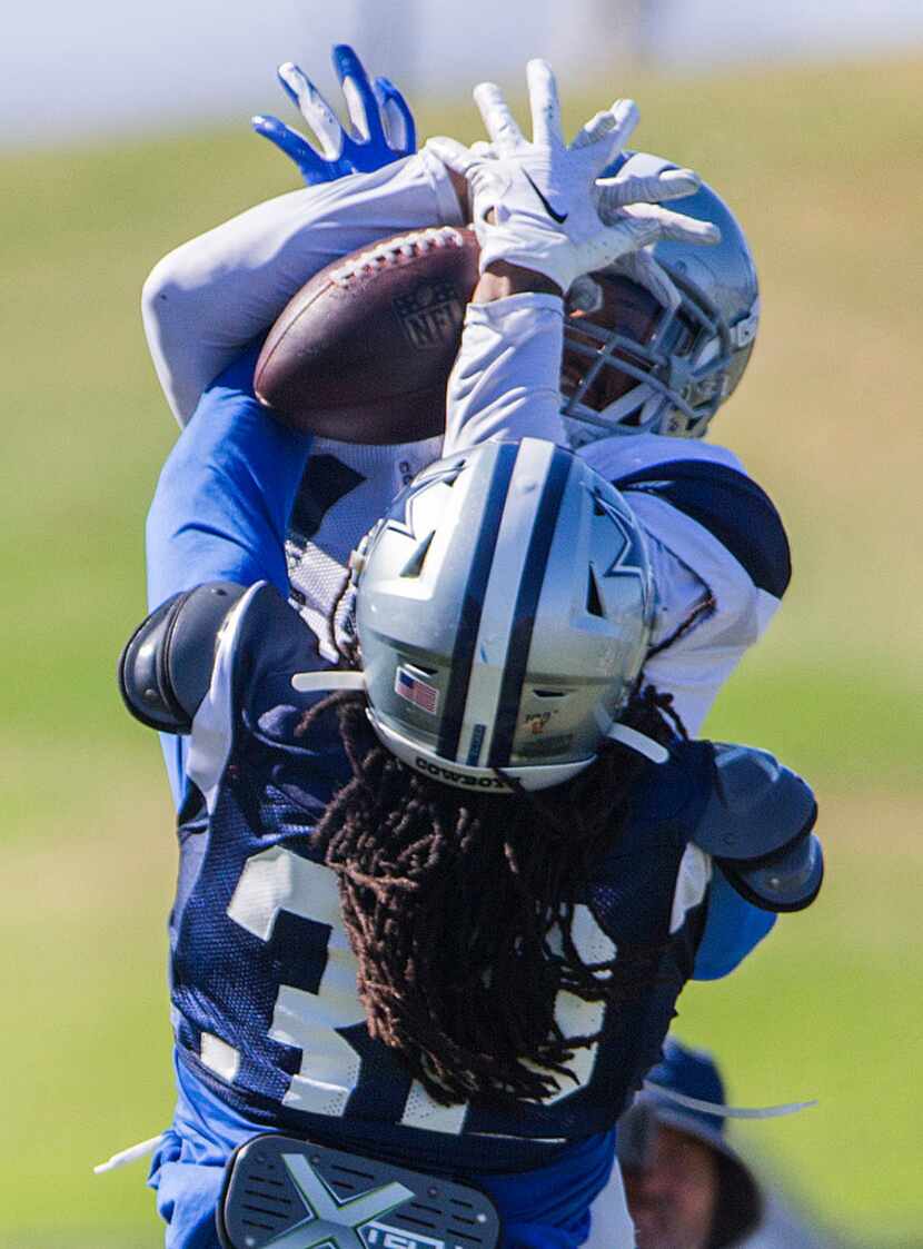 Dallas Cowboys cornerback Donovan Olumba (32) breaks up a catch by wide receiver Devin Smith...