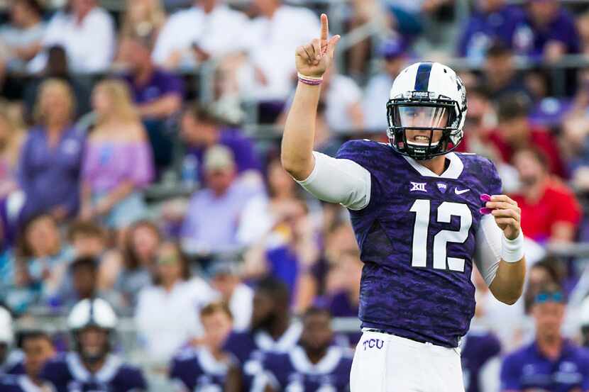 TCU quarterback Foster Sawyer signals a play during the second half of an NCAA football game...