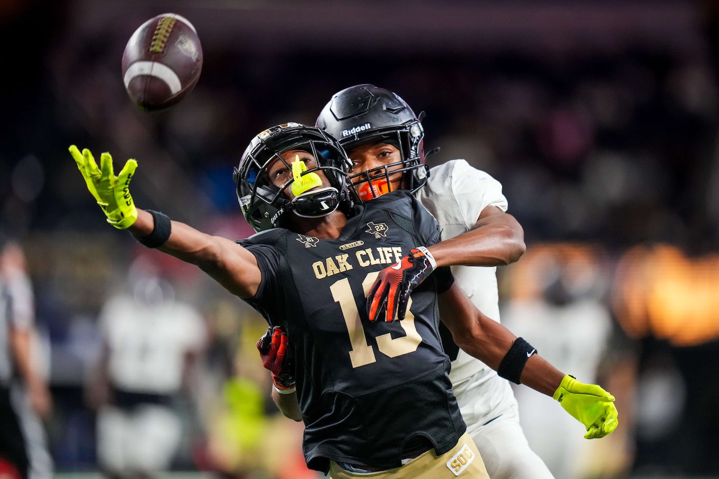 A pass goes just out of reach for South Oak Cliff wide receiver Jaylen Moore (13) as...