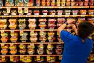 Manager Irene Muñoz faces the fresh cut fruit endcap at the Albertsons in Irving in 2023....