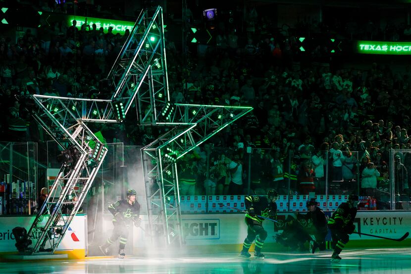 The Dallas Stars take the ice before the first period of an NHL game against the Vancouver...